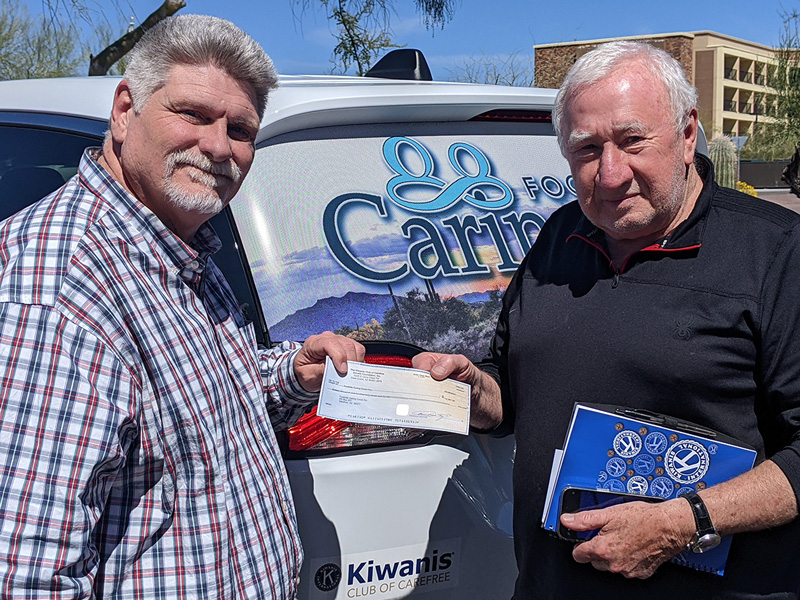 Brent and Kiwanis Tom with check
