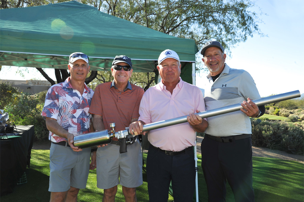 golfers holding the ball cannon